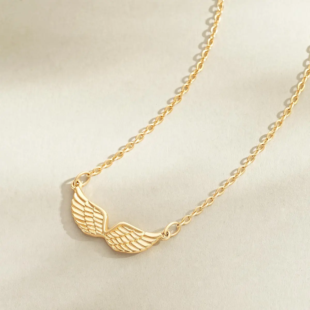 MEVECCO Dainty Angel Wings Necklace for Women | 18K Gold Plated Brass, 40.4 cm (15.7 in) Chain with 5 cm (2 in) Extender - view 6