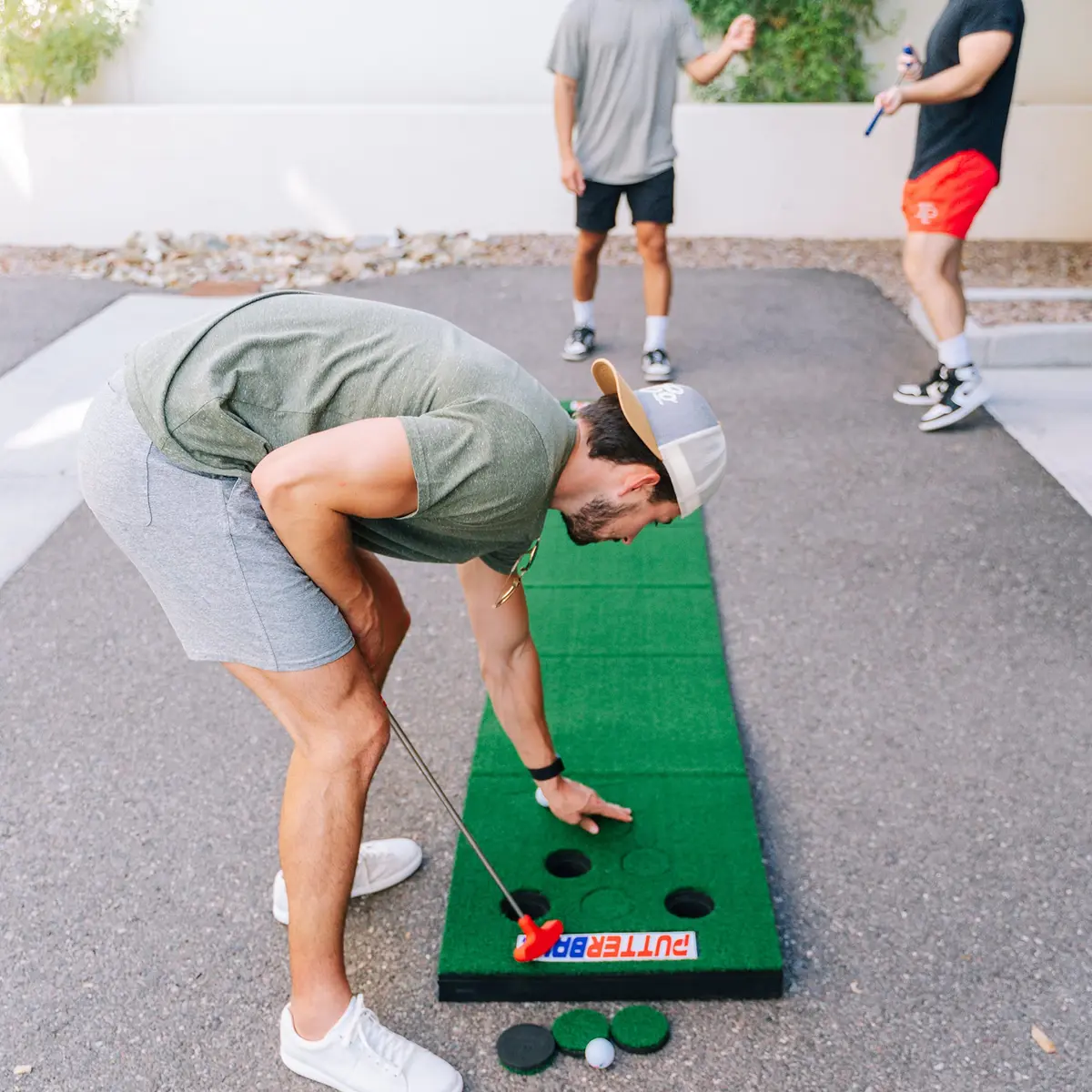 PutterBall Original Golf Putting Game Set – Backyard 12 ft Putting Green Pong Style Golf Mat with 2 Putters, 2 Balls & Hole Covers - view 5