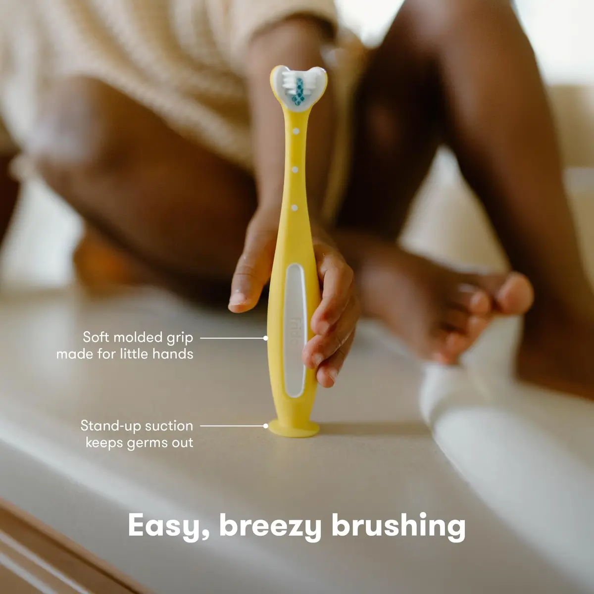 Frida Baby Triple-Angle Toothhugger Training Toddler Toothbrush | Toddler Toothbrush 2 Years and Up, Cleans All Sides at Once, Yellow (1 Count) - view 6