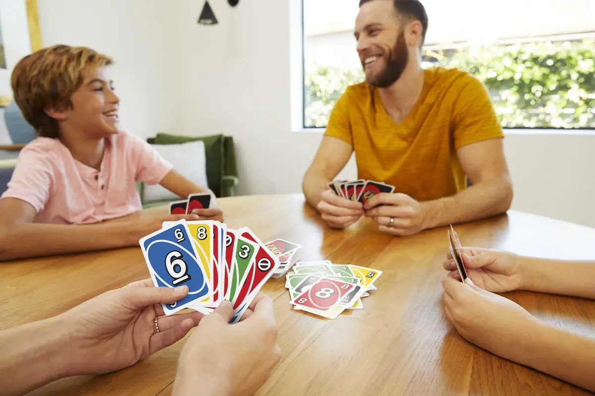 Mattel Games UNO Left Hand Tin Card Game for Family Night with Cards Specially Designed for Left-Handed Players (112 Cards) - view 2