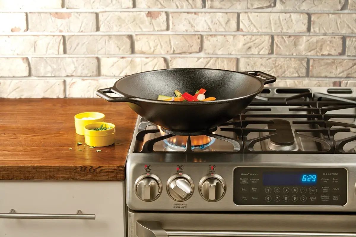Lodge BOLD 14 Inch Seasoned Cast Iron Wok with Red Silicone Assist Handle Holder | Induction Compatible - view 4