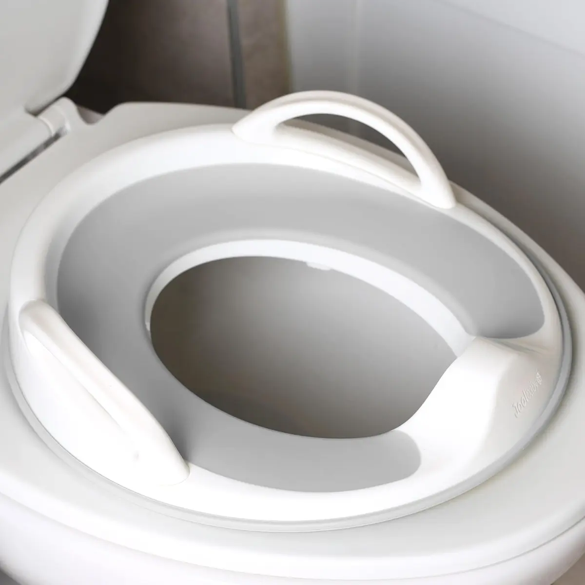Jool Baby Potty Training Seat for Boys and Girls With Handles, Fits Round & Oval Toilets, Non-Slip with Splash Guard (Gray) - main product image