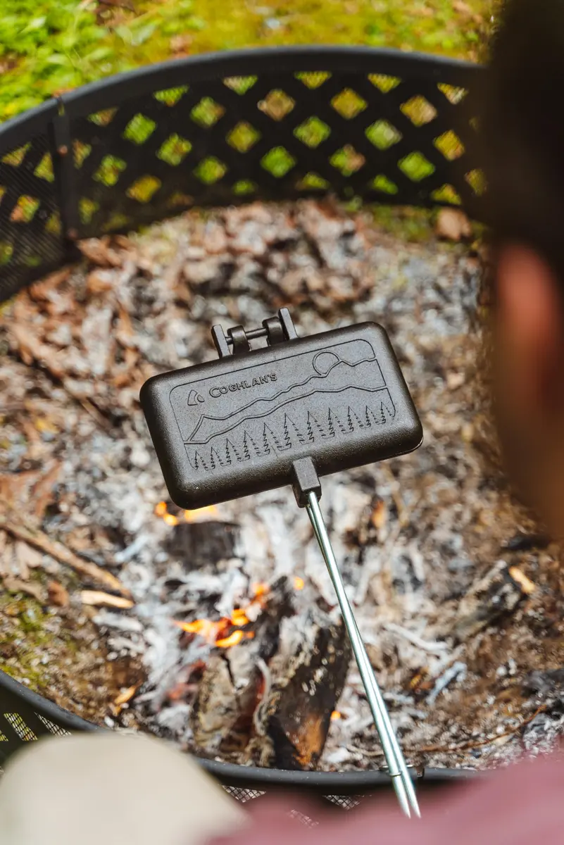Coghlan's Double Cast Iron Camp Cooker – Pre-Seasoned Double Pie Iron for Campfire Cooking, Makes 2 Camping Pies at Once, Removable Handles, Wooden Grips & Cleaning Scrubber - view 2